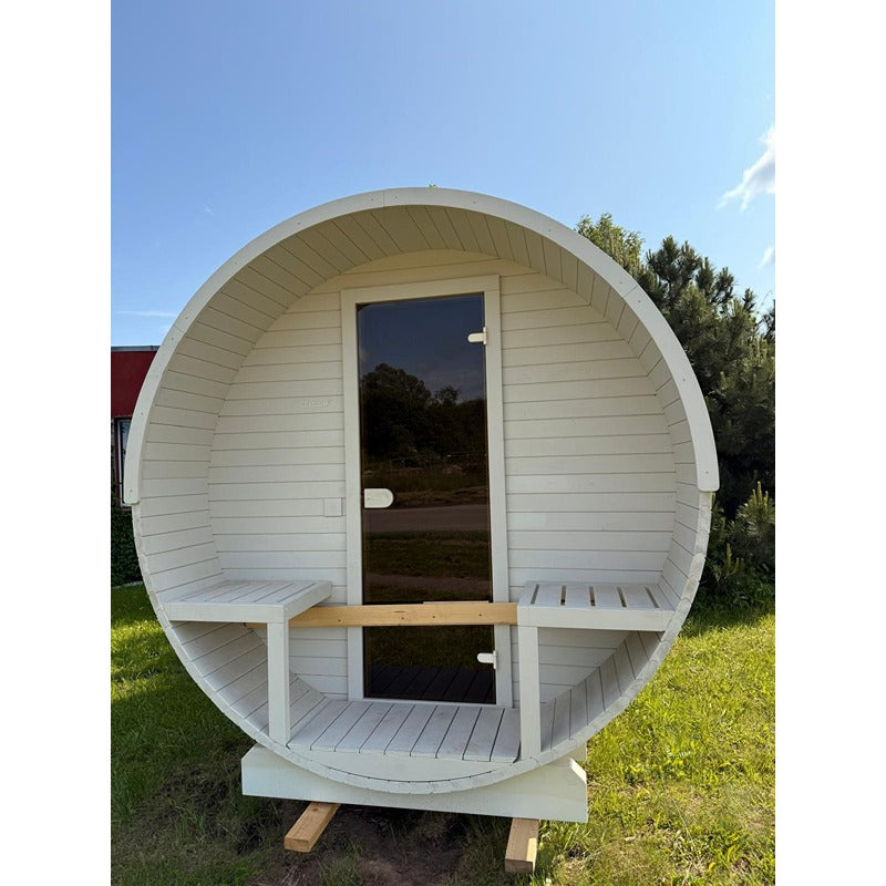 Front view of the white Celsium Joris Large Barrel Sauna with black glass door and integrated seating in the entrance area
